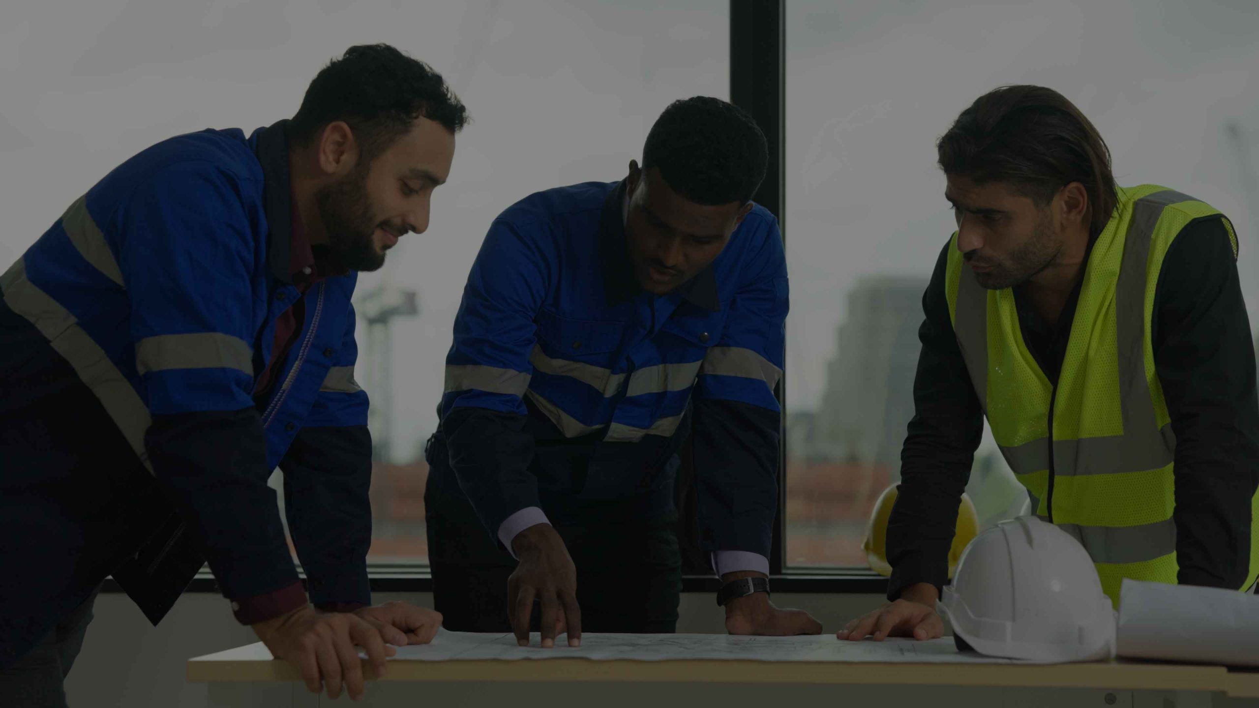 Construction engineers team using blueprint of proj ... Professional construction engineers team using blueprint of project plan brainstorming and working together at construction building, Architecture and building construction concept